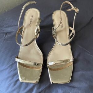 Gold strappy heels